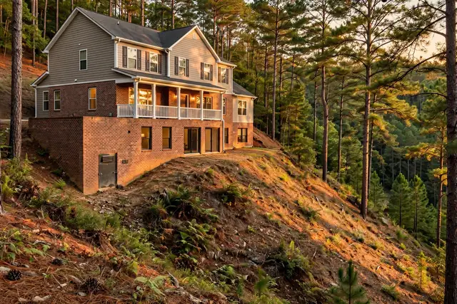 Hillside Vestavia Hills home with a daylight basement and crawl space entry